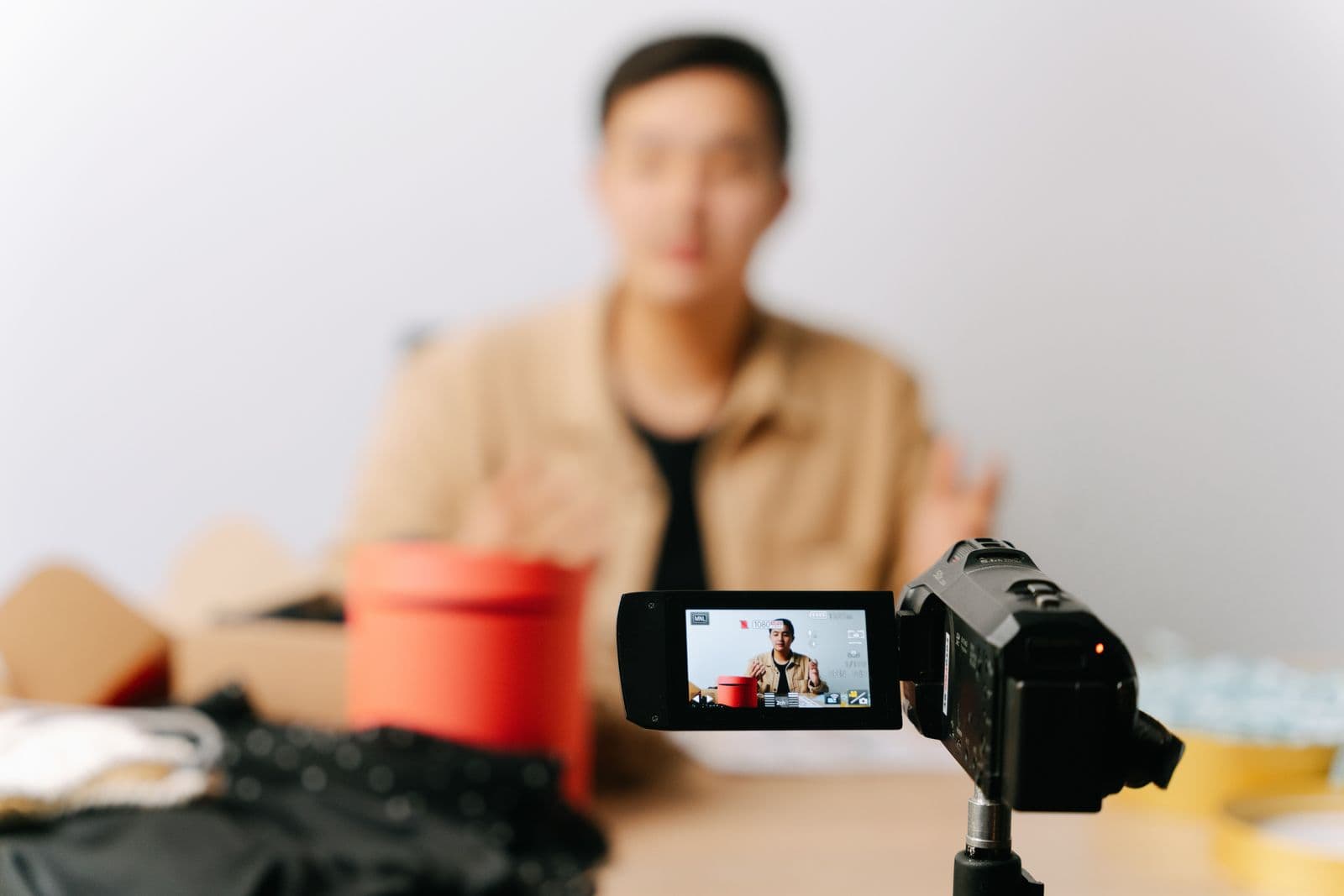 A creator recording a piece to camera, viewed through the camera screen