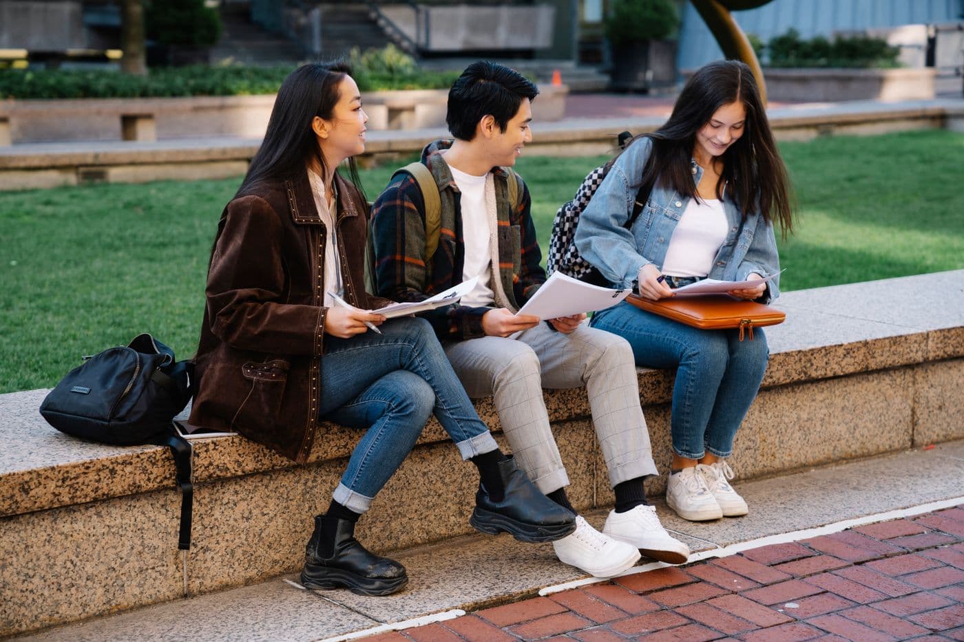 Students working together at a table on a university campus